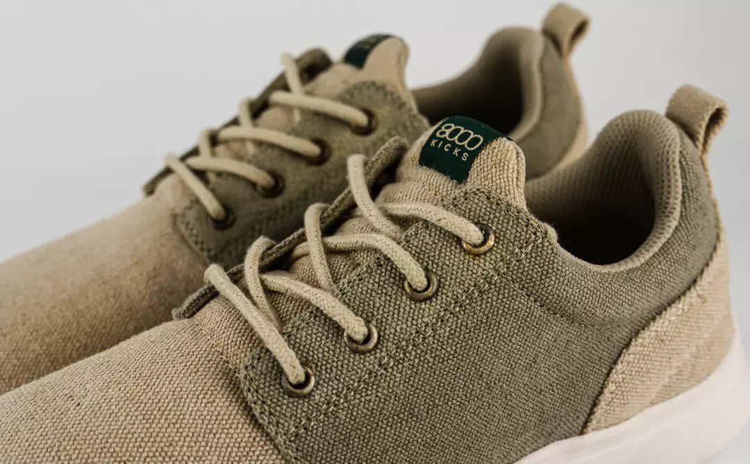 A pair of beige and green waterproof hemp shoes by 8000 Kicks.